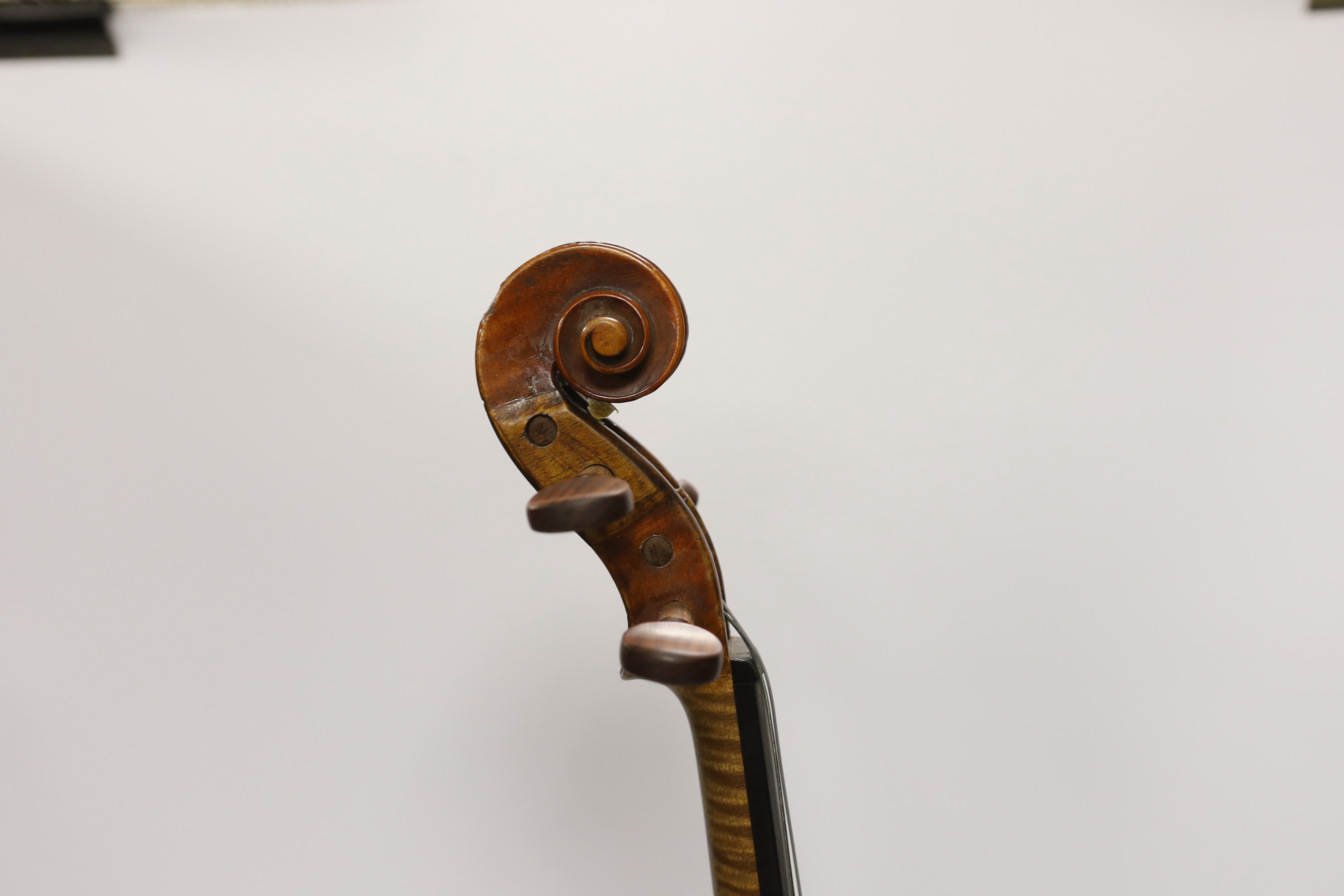 A French violin with a label for J. Nicolas Aine, a la Ville de Cremonne in an ebonised wooden case with outer canvas cover, body 36cm (without bow)